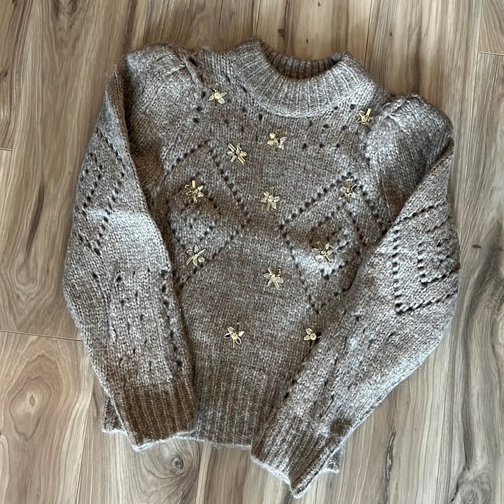 Beige sweater with sparkly flowers and poofy shoulders